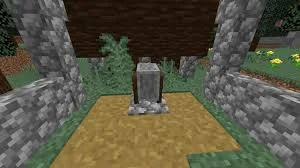 Bloque de Afiladora colocado junto a un muro de piedra en Minecraft
