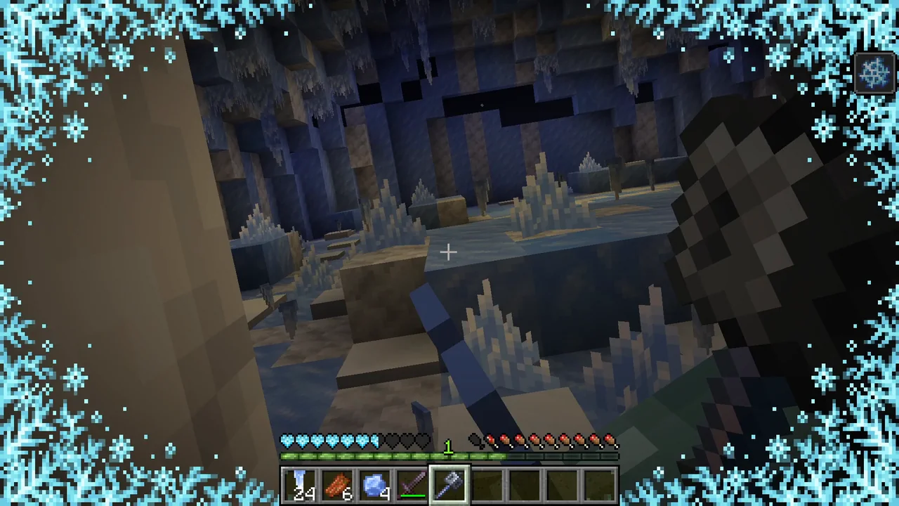 Pantalla de Minecraft con escarcha cubriendo los bordes y corazones de salud azules por el efecto de Congelación